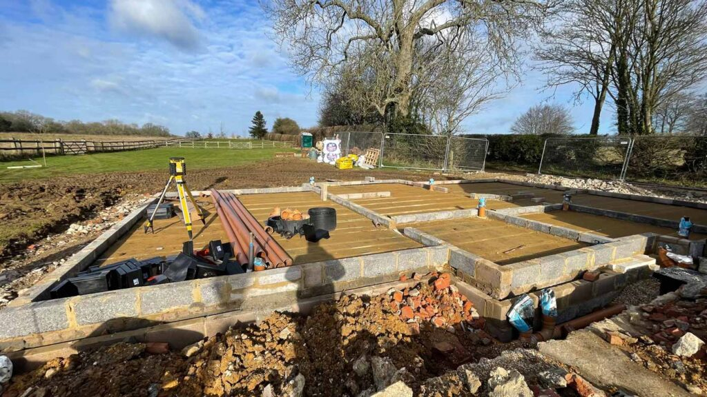 Eco new build foundations being constructed for a new house, showcasing sustainable construction practices.