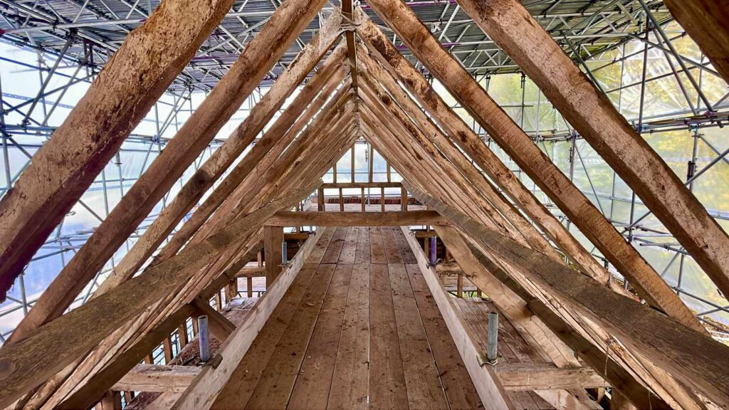 Roof beams showcasing the craftsmanship of the structure. Roof restoration Buckinghamshire.